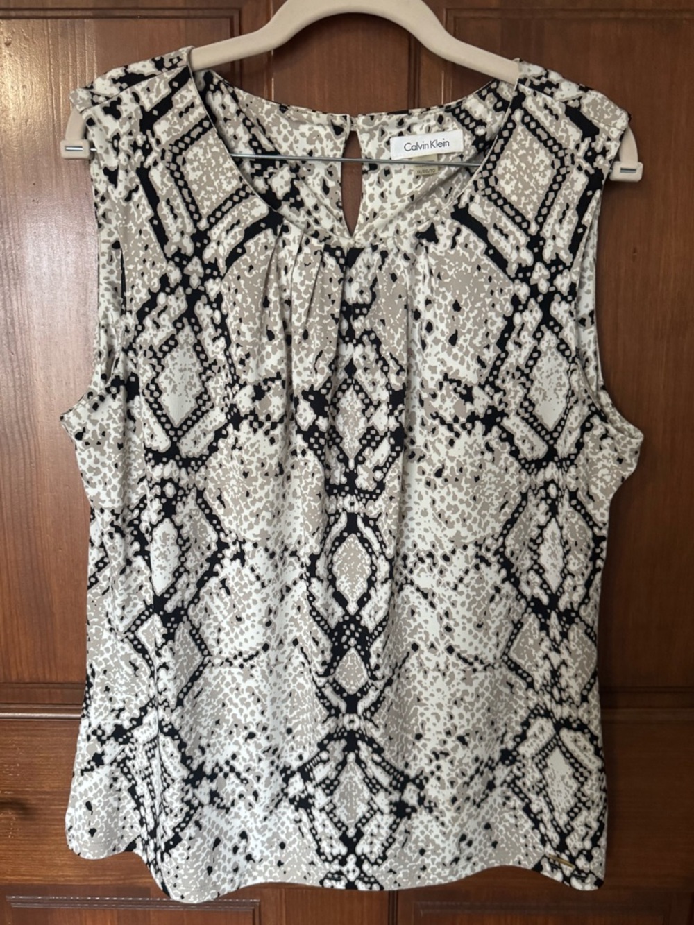 Calvin Klein Sleeveless Snake-Print top in Black and cream.